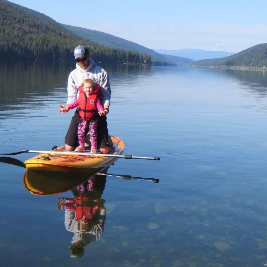 Father and Daughter paddle board by Jayme Hiller